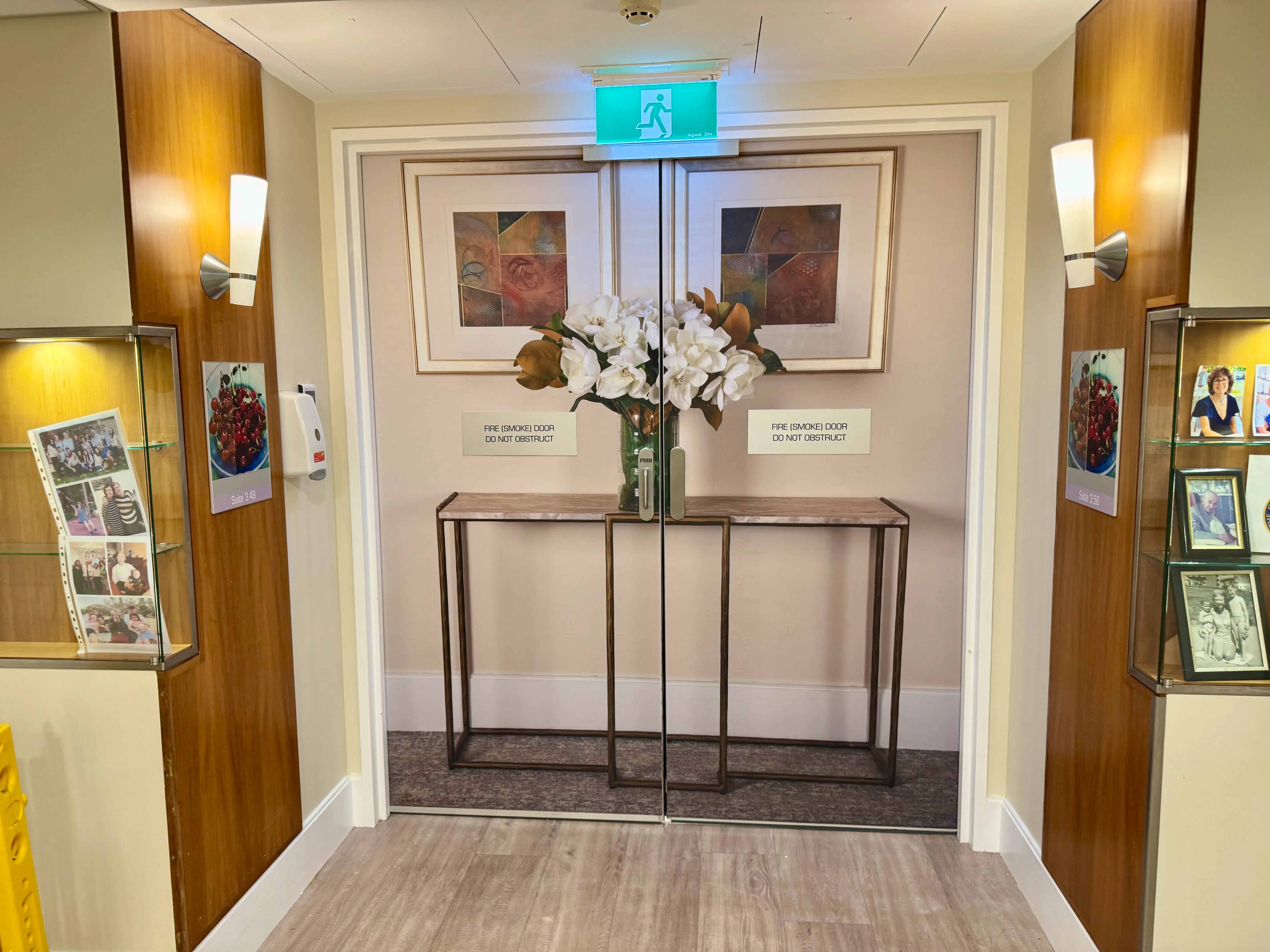 Fake wall print on fire exit doors in dementia ward at Aged Care facility