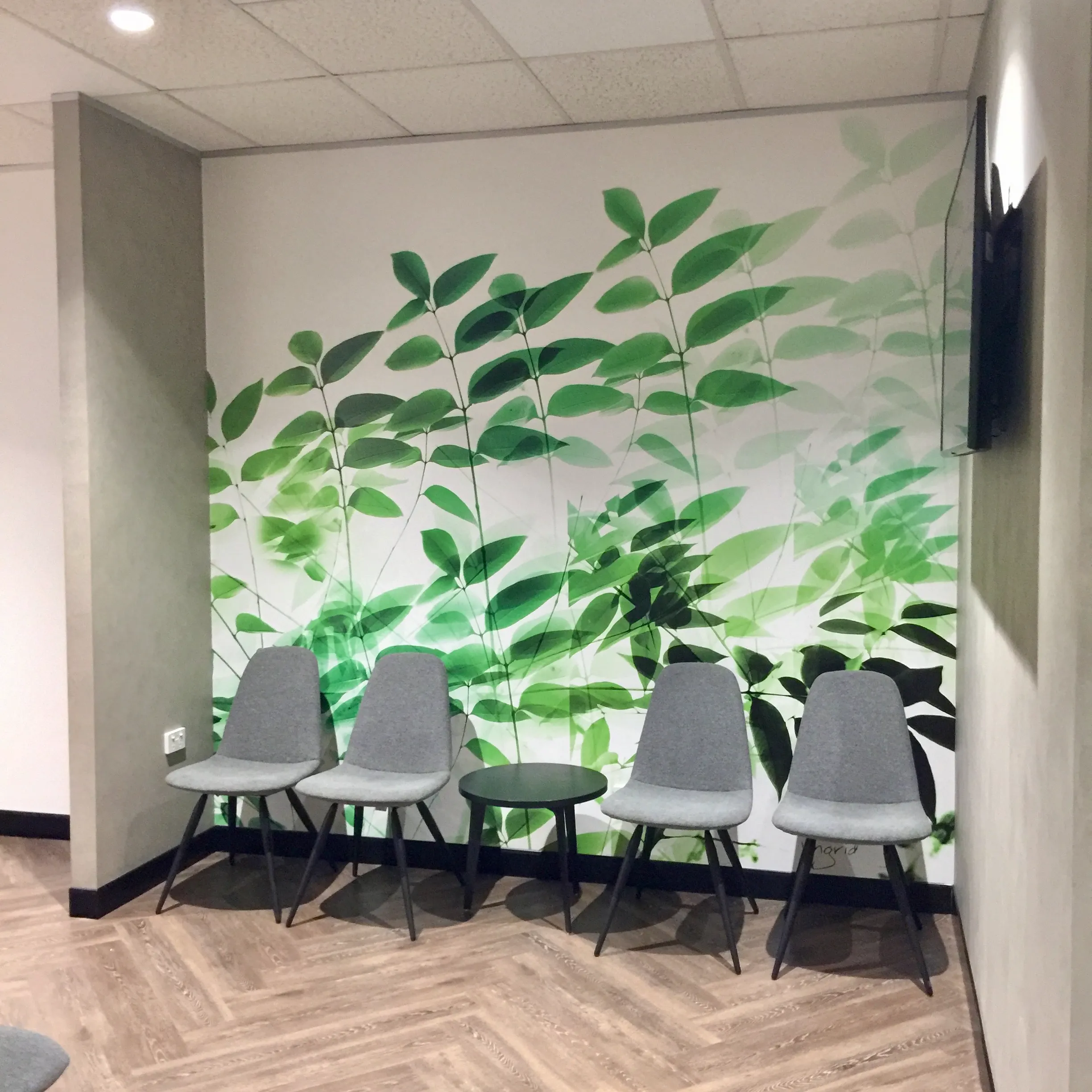 Leafy wallpaper art for this waiting area at medical practice