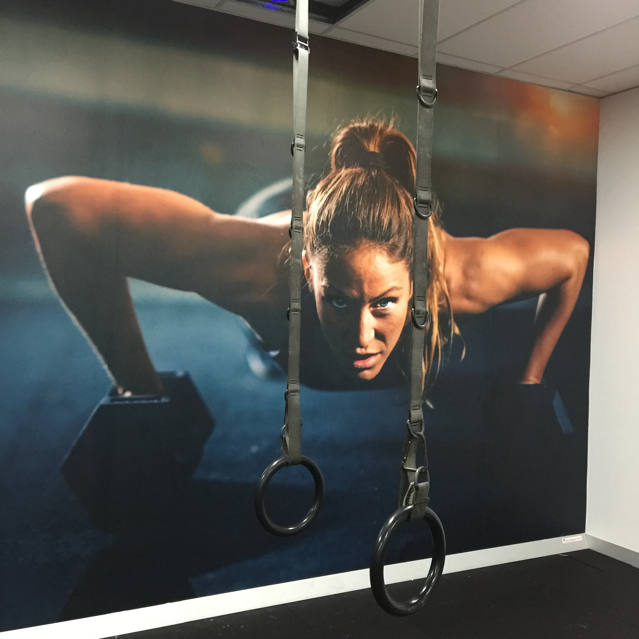 Woman at workout on custom wallpaper print at Sydney gym