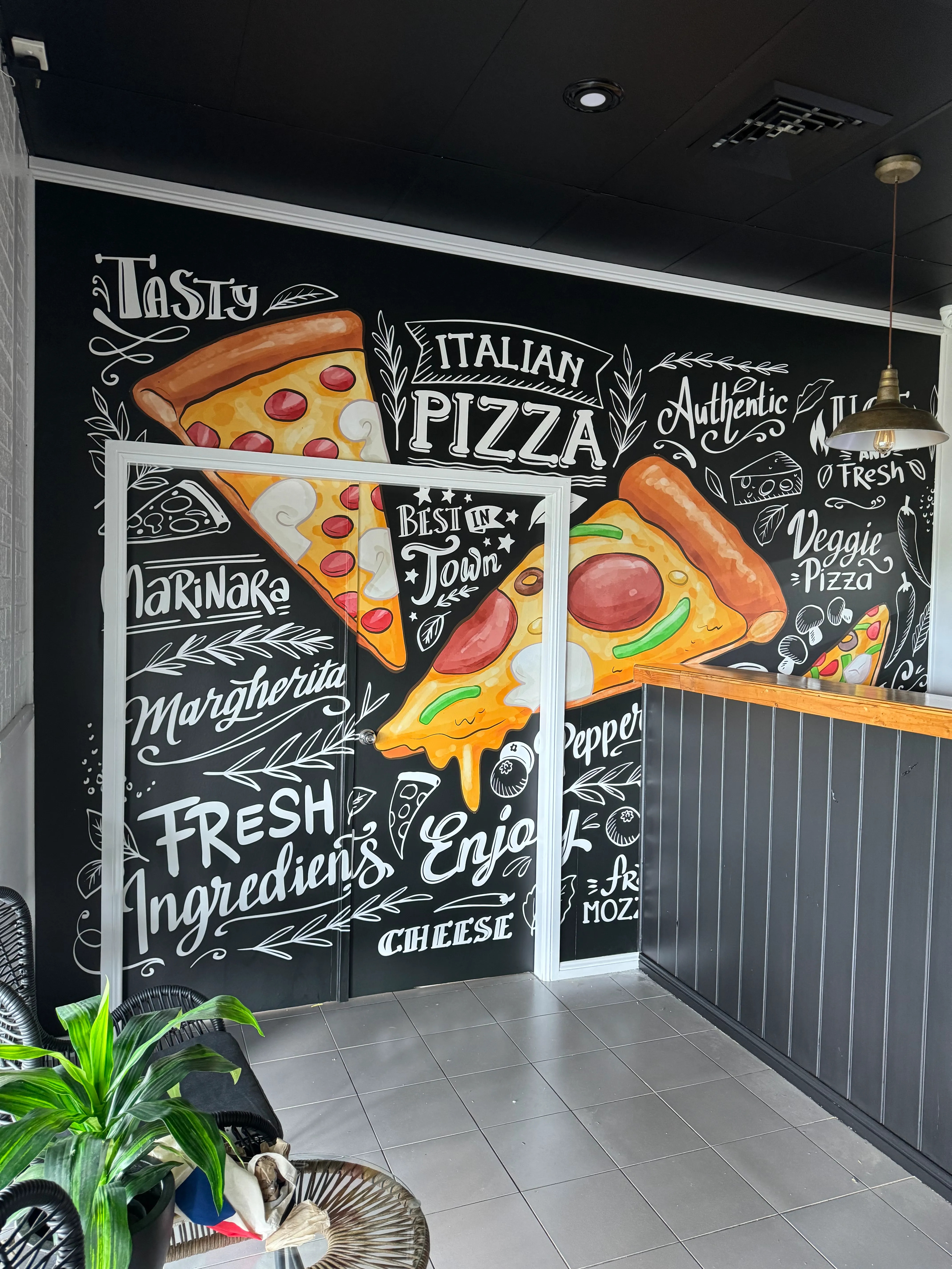 Custom printed wallpaper mural at a pizzeria