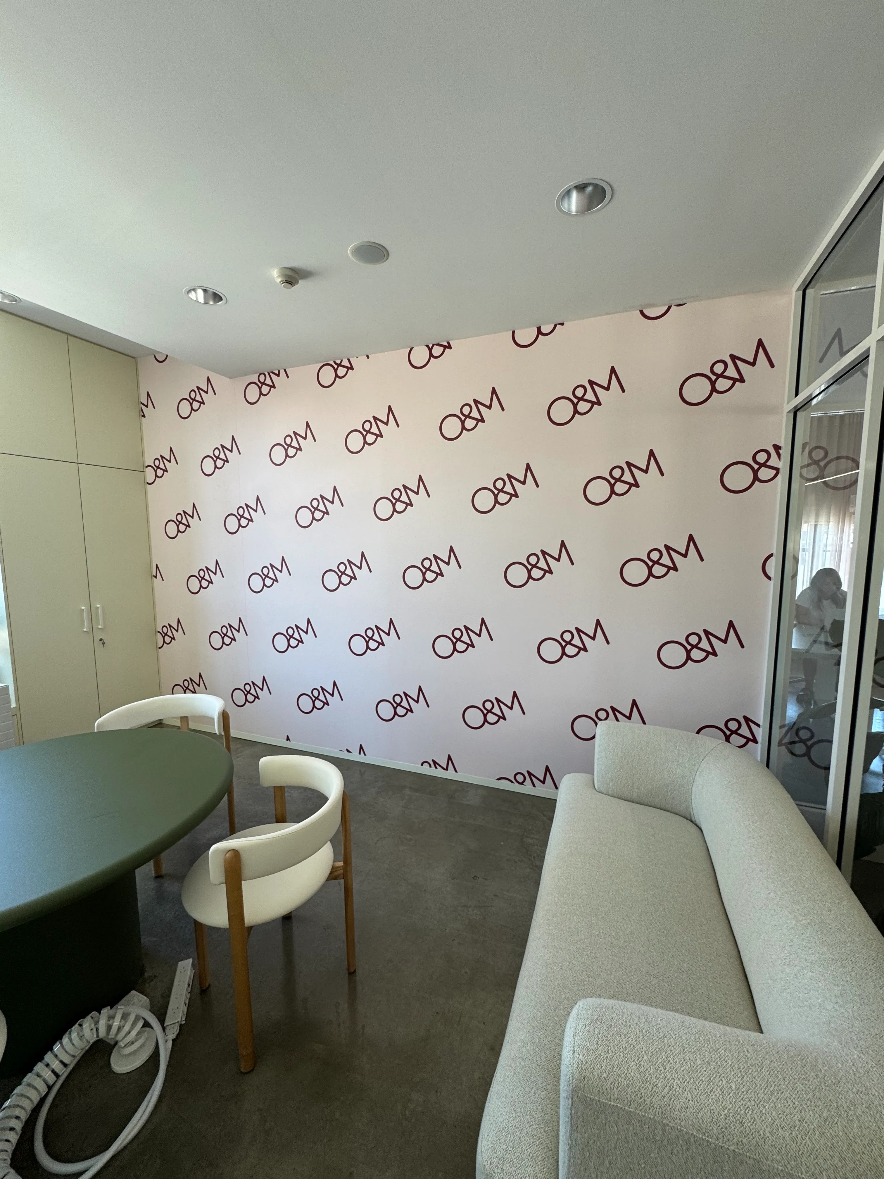 Custom printed wallpaper with company logo in diagonal pattern