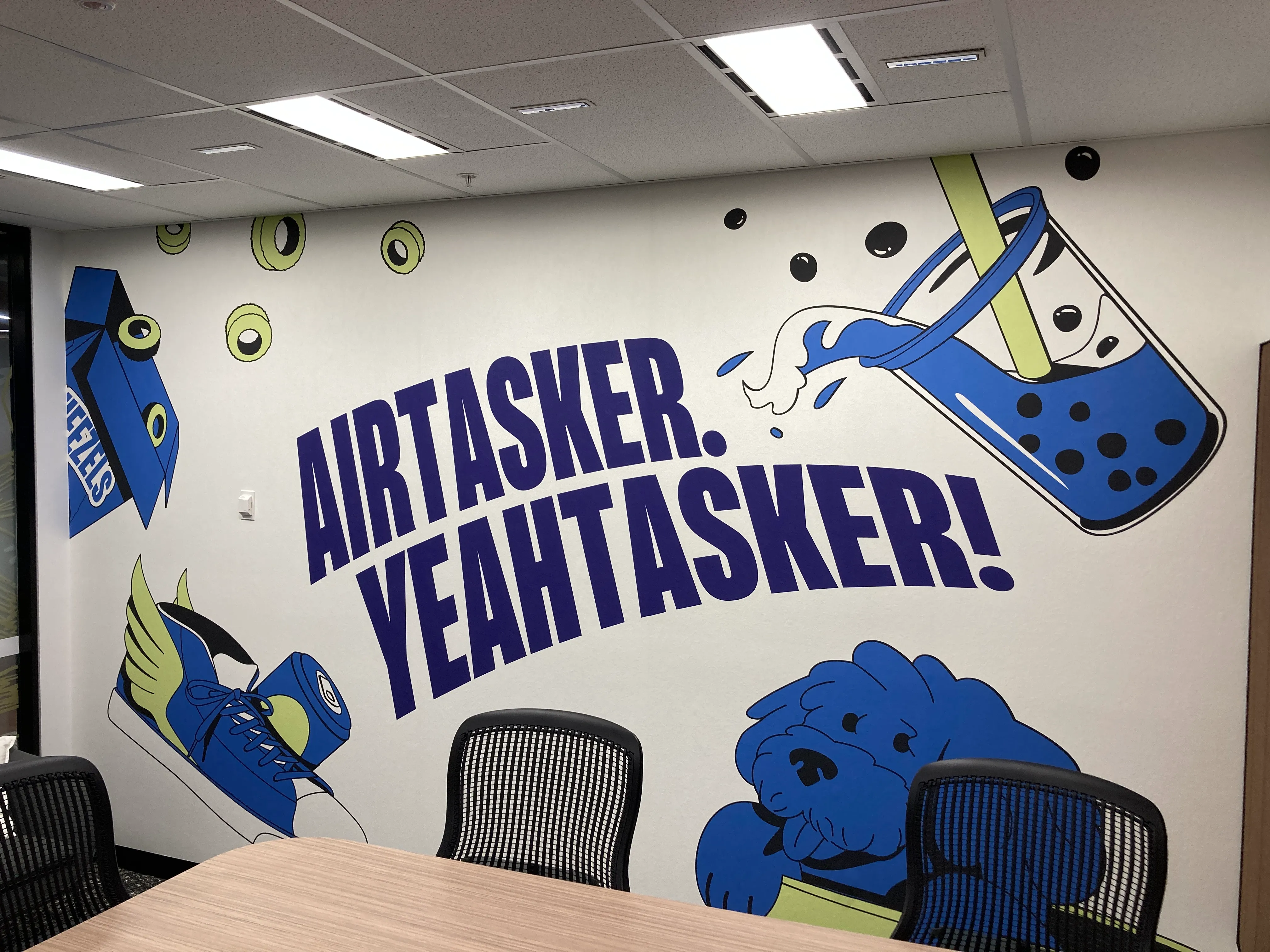 Custom wallaper mural in meeting room with company branded ullistration