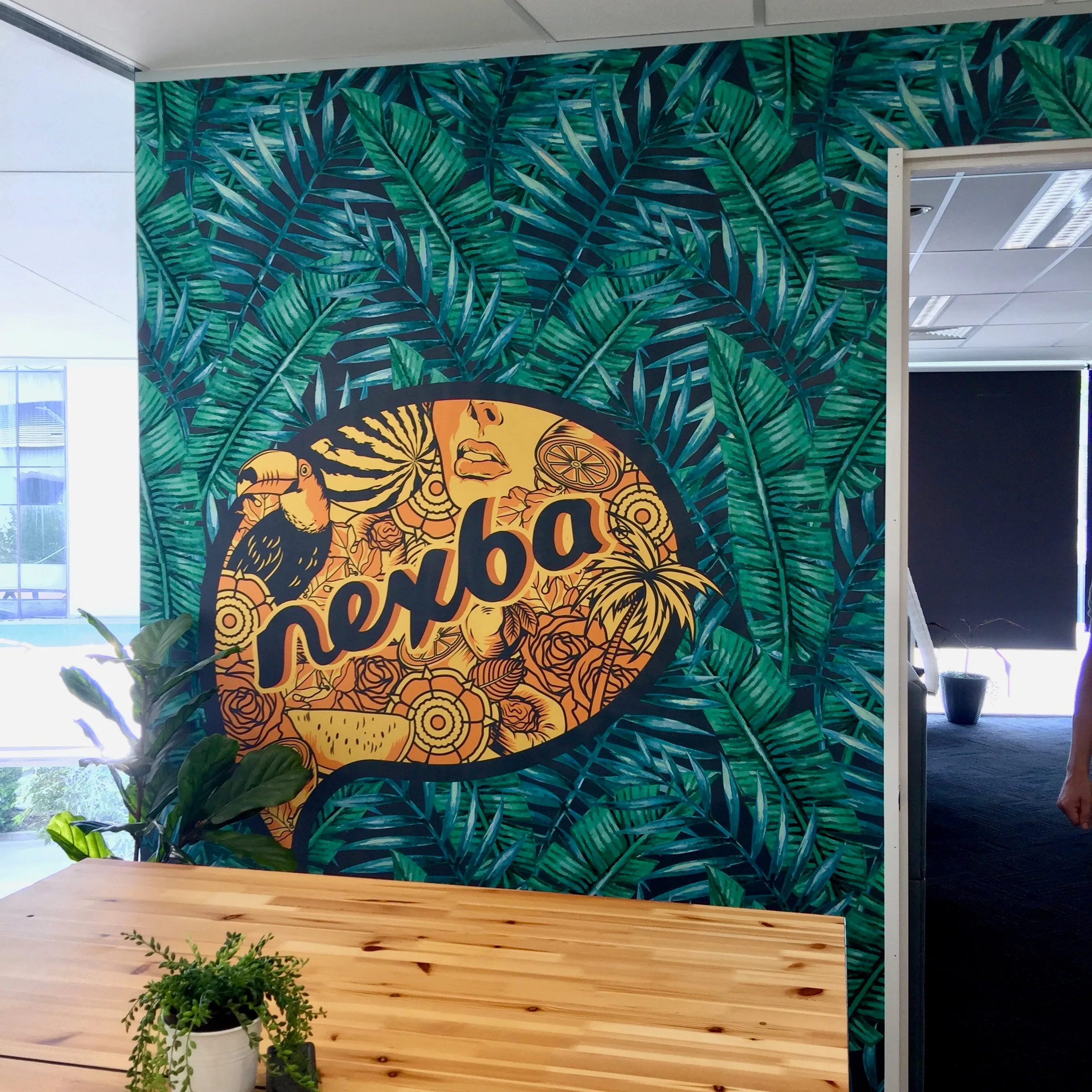 Custom wallaper mural in break out room with company branding