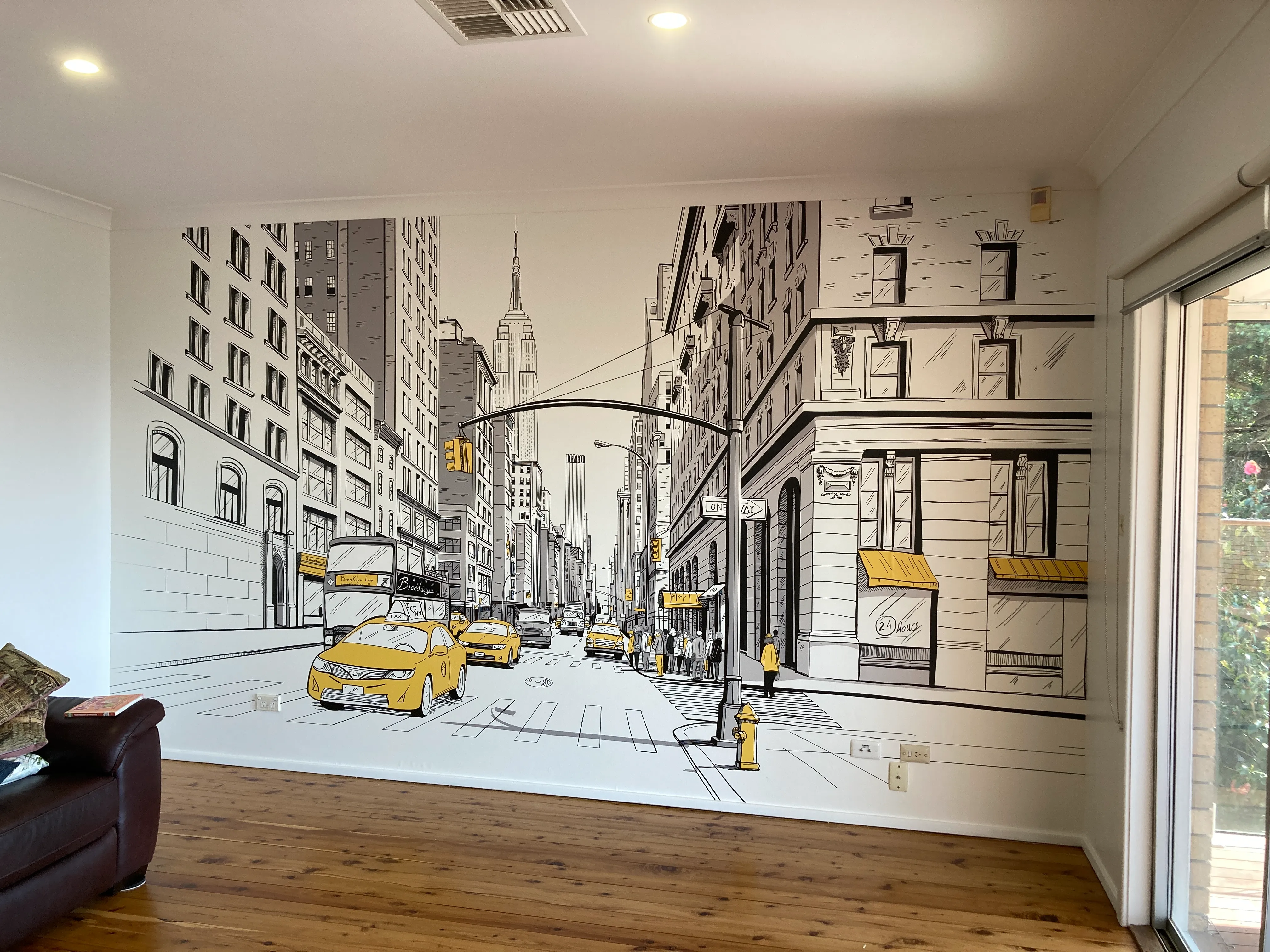 Living room with New York illustration on custom wallpaper