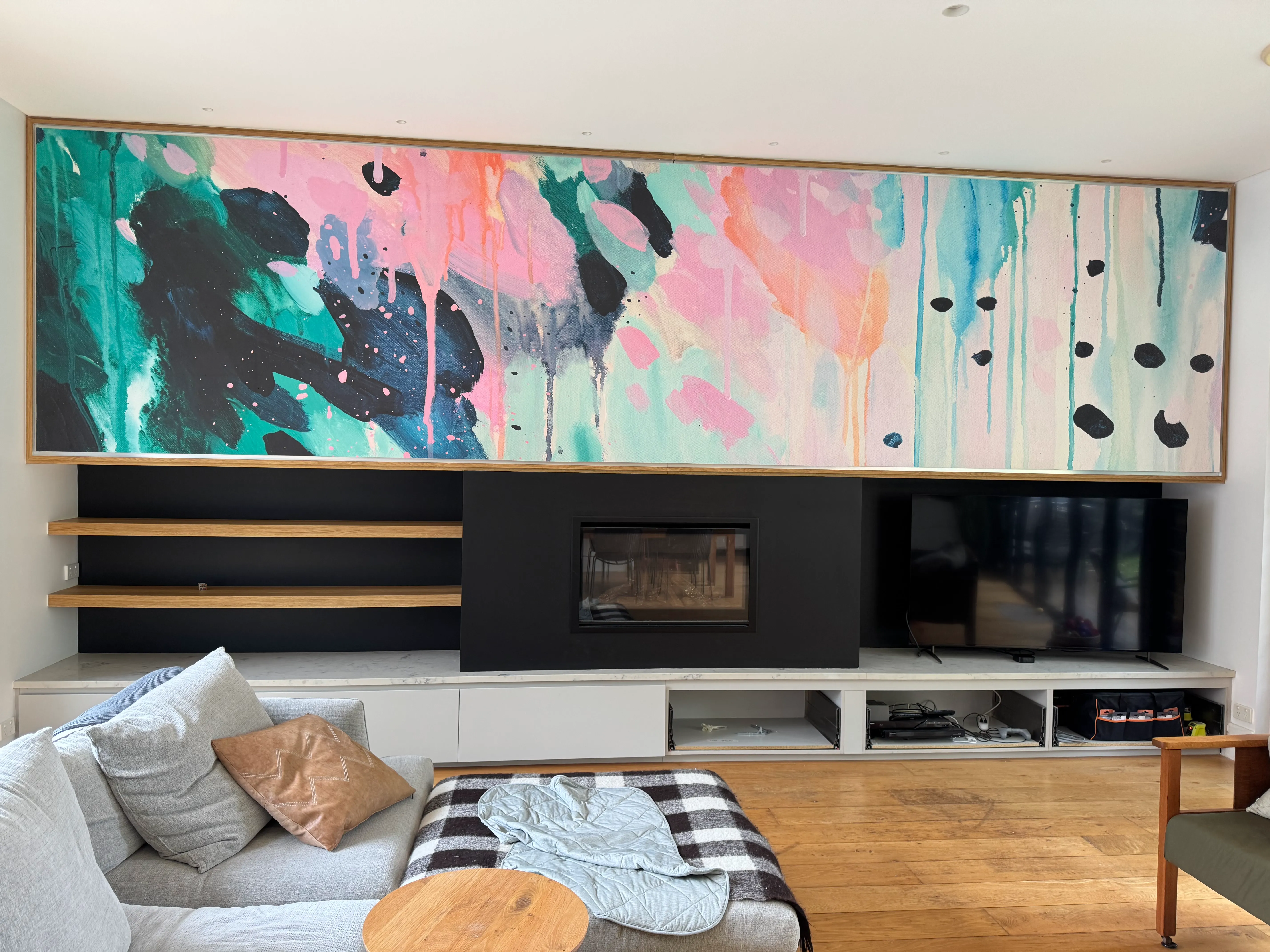 Reproduction on wallpaper of Jane Lewis artwork in living room