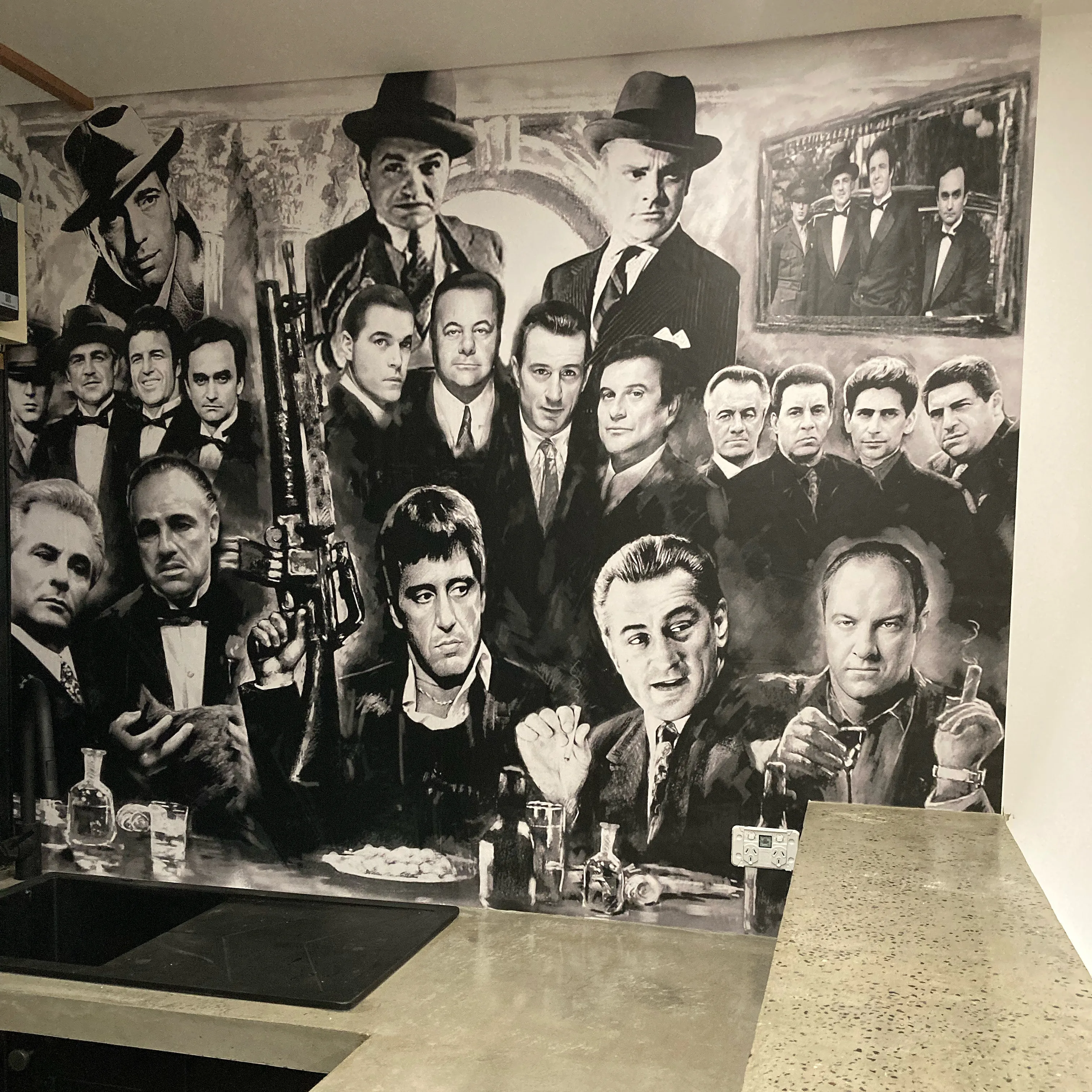 Gangster portraits on custom wallpaper for private bar area